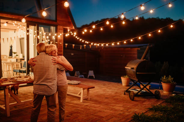 istock Lovely senior couple celebrating wedding anniversary with dancing. 1354179330