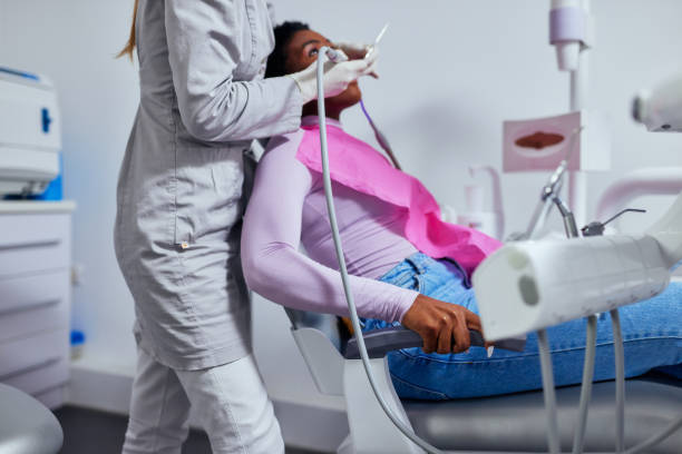 istock Dentist performing a procedure on a patient 1354179863