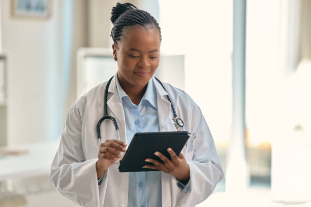 istock Shot of a young female doctor using a digital tablet at work 1354181155