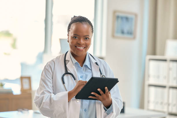 istock Shot of a young female doctor using a digital tablet at work 1354181156