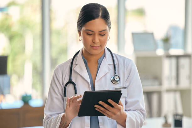 istock Shot of a young female doctor using a digital tablet at work 1354181172