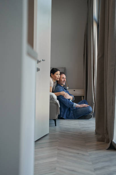 istock Happy aged couple during romantic day indoors 1354181615
