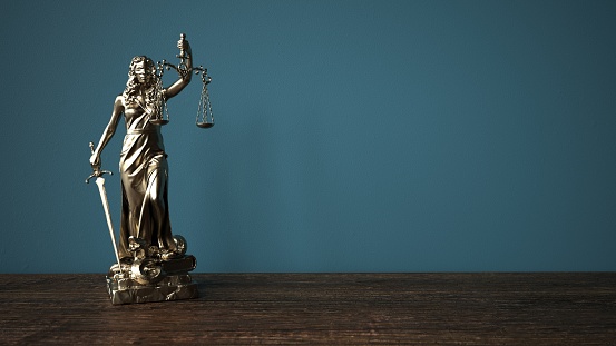 Lady justice statue on the wooden table. 3d illustration.