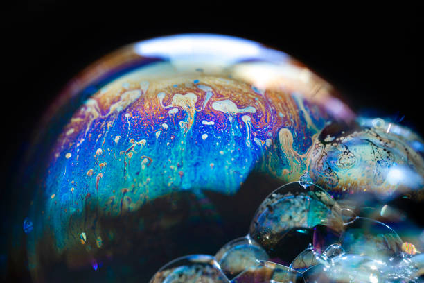 istock Abstract pattern, multicolored chaotic texture inside of the soap bubble, closeup 1354185334