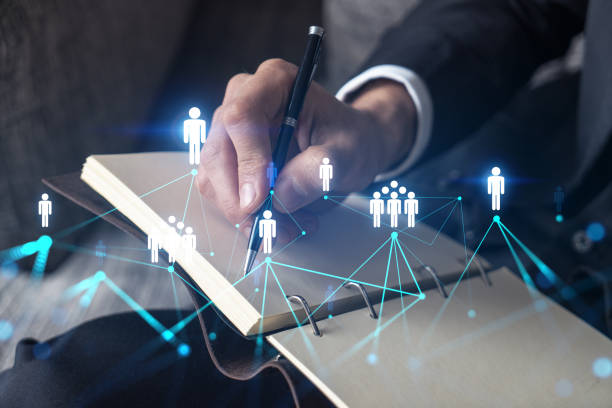 istock Businessman takes notes. Business network concept. 1354188209