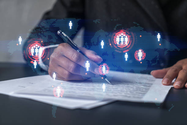istock World map and a woman signing papers. Double exposure. 1354188965