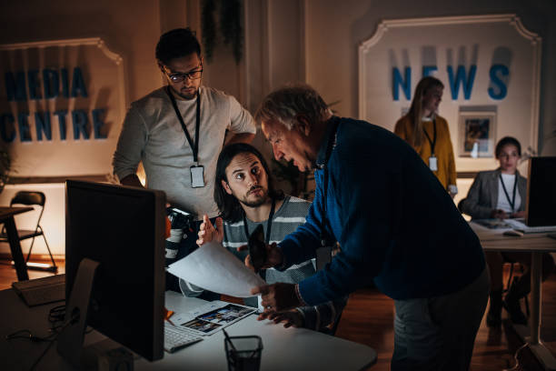 istock Working late in news editorial office 1354189397