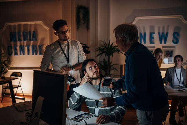 istock Working late in news editorial office 1354189508