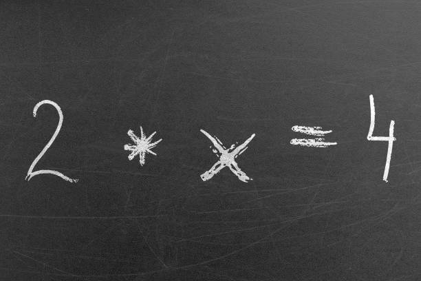 istock Simple math multiplication equation on the chalkboard in the school 1354189622