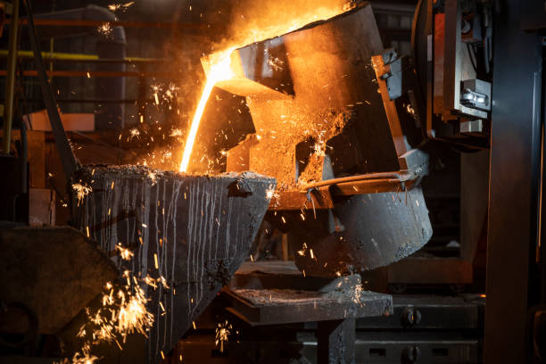 istock Pouring of liquid molten metal to casting mould using forklift 1354189720