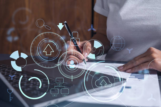 istock A client is signing a contract to create a new software to present it in start up conference and gain investments to create a product. Technological graph over the desk. Women in business concept. 1354189826