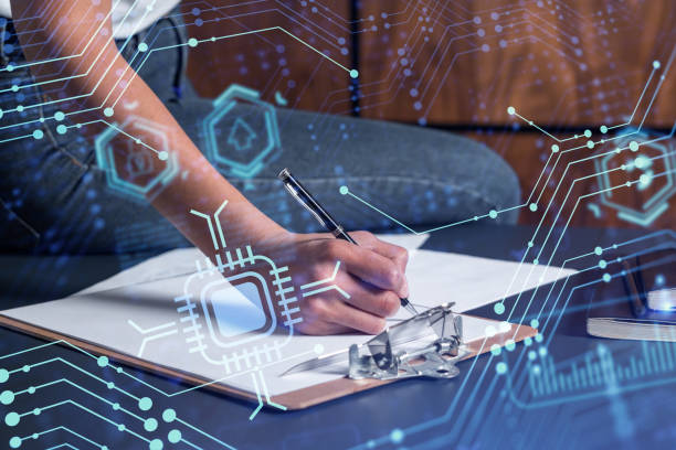 istock A client is signing a contract to create a new software to present it in start up conference and gain investments to create a product. Technological graph over the desk. Women in business concept. 1354189829
