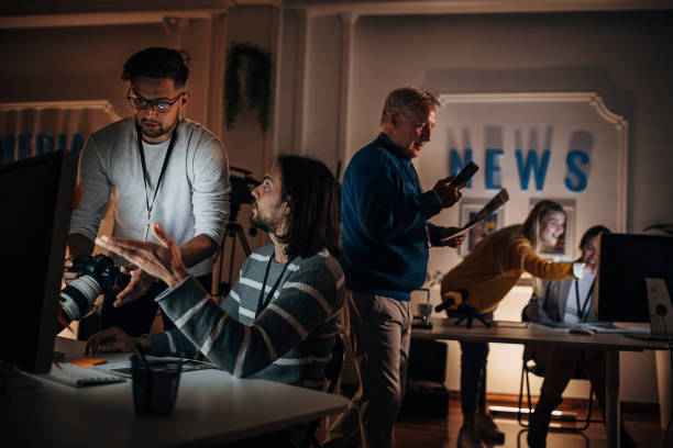 istock Working late in news editorial office 1354190067