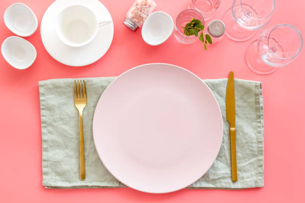 istock Dinner plate setting with cutlery and napkin. Top view 1354191149