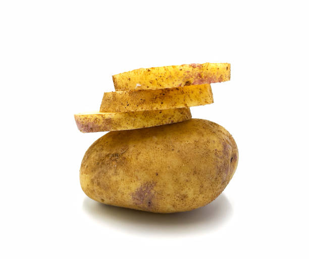 istock Raw potatoes Isolated potatoes. Raw potatoes and cut pieces 1354191310