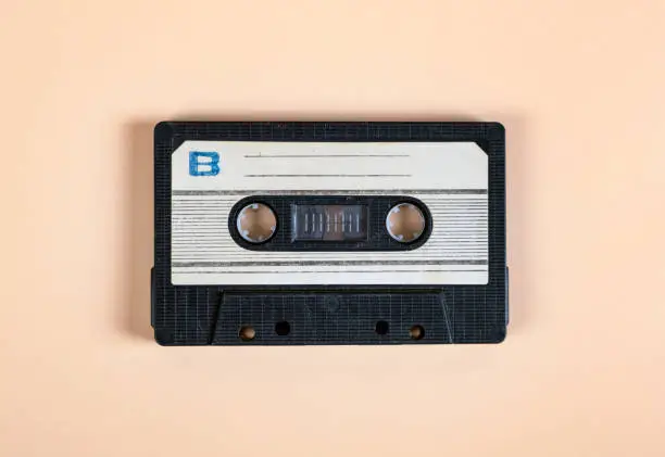 Old Audio Cassette on the Paper Background closeup