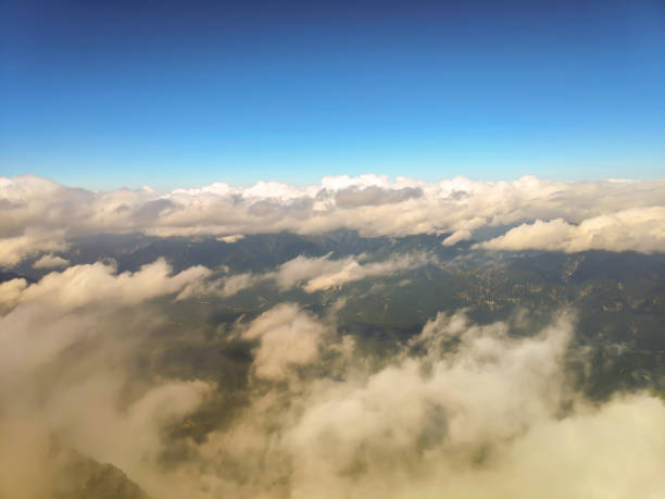 istock Mountain peaks in the clouds 1354192273