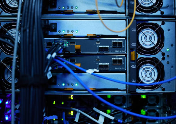 istock Shot of electronic equipment in an empty server room 1354192742
