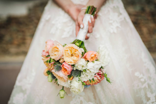 istock Bride holding a beautiful bouquet 1354193248