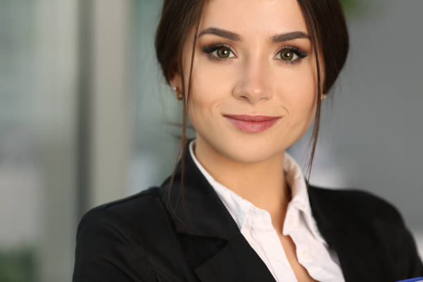 istock Pretty young female secretary posing at the camera 1354194160