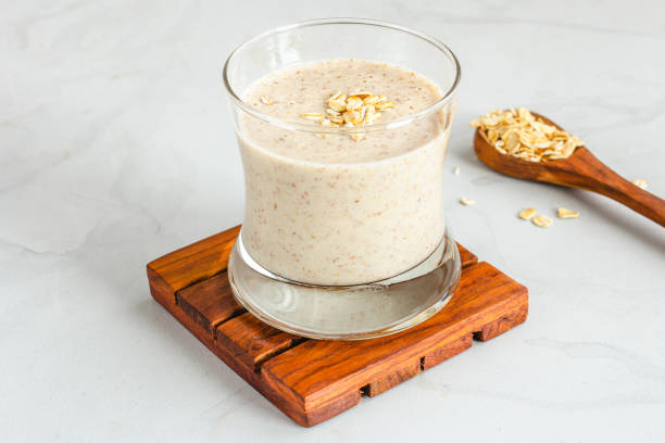 istock Healthy Oat Smoothie in a Glass on White Backgeound 1354194753