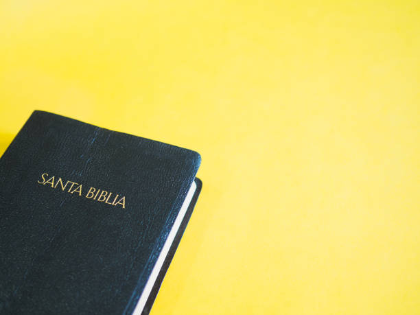 istock Holy Bible in Spanish with yellow copy space. Religion concept 1354197437