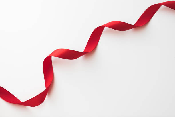 istock loops of red  ribbon on gray text place - Image 1354197498