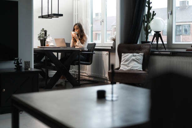 istock Entrepreneur working at home by her laptop 1354199087