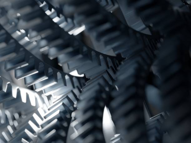 istock Steel gears from an engine gearbox, close up. High performance engines, concept. Digital 3D rendering. 1354202647
