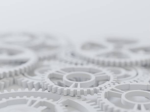 istock Precision engineering, concept background. Shiny steel gears on light surface. Digital 3D rendering. 1354202719