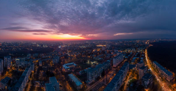 istock Aerial evening view, illuminated city streets pano 1354203065