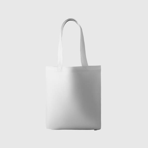 istock Mock up of white totebag 3d rendering, reusable ecobag with handle, for shopping, isolated on background. 1354204868