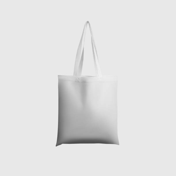 istock Mock up of white totebag 3d rendering, reusable ecobag with handle, for shopping, isolated on background. 1354204905