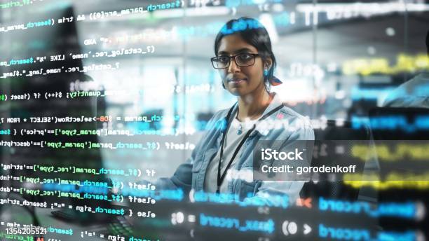 Diverse Office Portrait Of Confident Indian It Programmer Working On Desktop Computer Professional Female Specialist Develop Innovative Software Shot With Visual Effects Of Running Code Stock Photo - Download Image Now