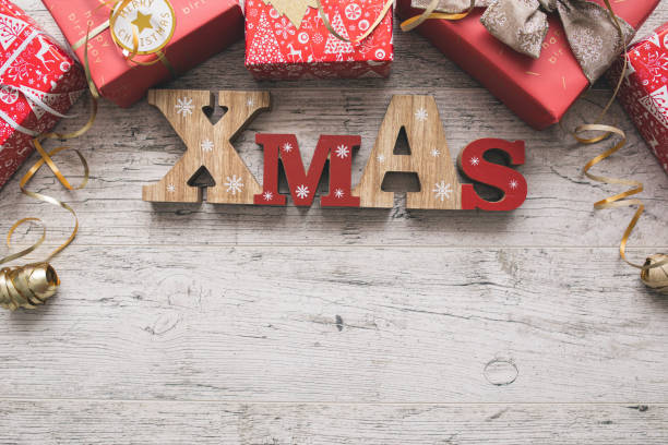 istock Christmas Gift Boxes on Wooden Table 1354206283