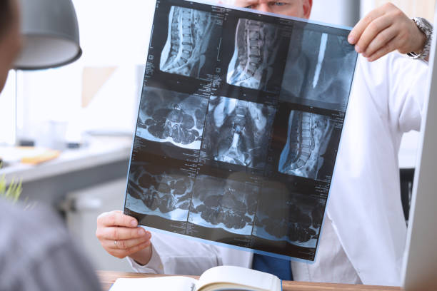istock Attentive medical worker doing checkup of X-ray photo 1354206449