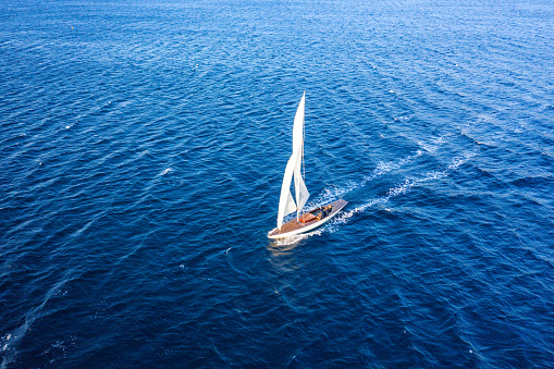 Classic sail boat in Mediterranean sea, aerial view