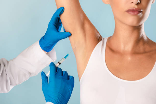 istock Woman having hyperhidrosis treatment at beauty salon 1354208284