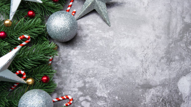 istock Christmas decorations, pine tree leaves, balls, berries on grunge background, Selective focus christmas concept 1354208332