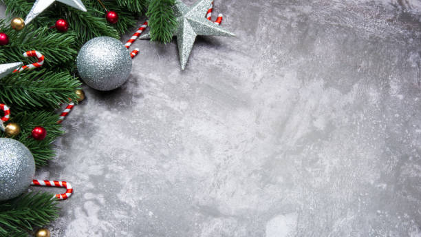 istock Christmas decorations, pine tree leaves, balls, berries on grunge background, Selective focus christmas concept 1354208959