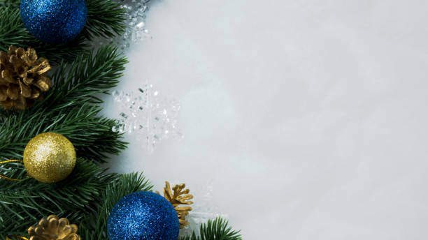 istock Christmas decorations, pine tree leaves, balls, berries on snow white background, Christmas concept 1354209166