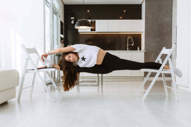istock Young attractive smiling woman practicing yoga 1354209983