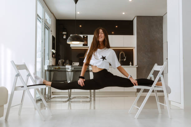 istock Young attractive smiling woman practicing yoga 1354210603