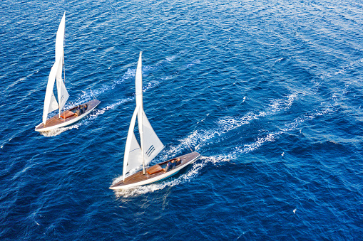 Two classic sail boat in Mediterranean sea, aerial view