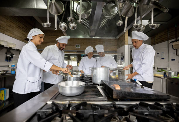 istock Cooks and chef working at a restaurant 1354214226