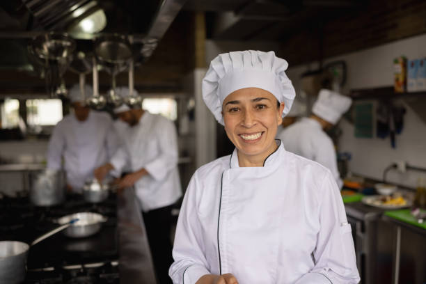 istock Happy head chef working in the kitchen at a restaurant 1354214257