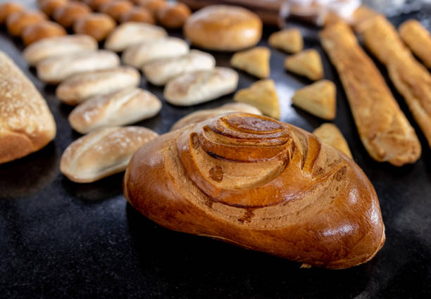 istock Fresh bread from the oven on the counter of a bakery 1354214361