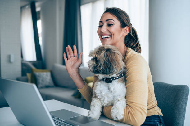 istock Cheerful woman having video call at home. 1354217827