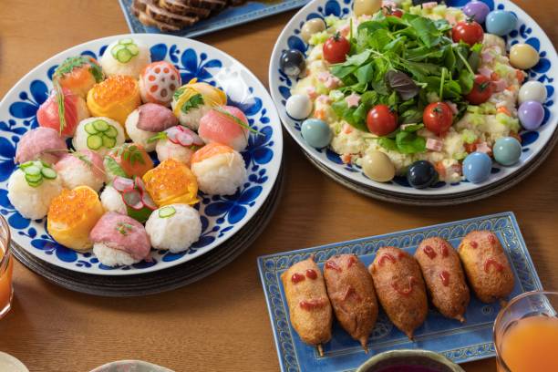 istock Party dining table with colorful meals (sushi) 1354218171