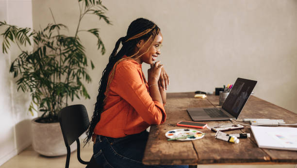 Smiling graphic designer attending a virtual meeting